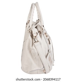 White Stylish Purse Or Handbag For Women On A White Background. Soft Leather With Two Handles And A Shoulder Strap, Drawstrings, And Gold Accessories. Side View.