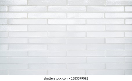 White subway tile background with rectangular bricks.