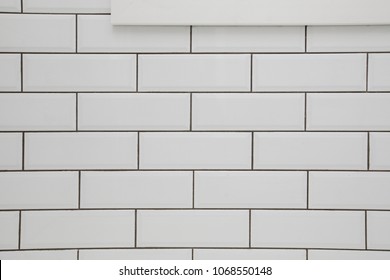 White Subway Tile Wall With A Window In It And Dark Grout For A Kitchen Or Bathroom Backsplash