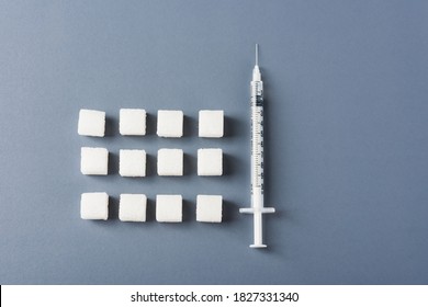 White Sugar Cube Sweet Food Ingredient Geometry Pattern And Syringe Tube, Studio Shot Isolated On A Gray Background, Minimal Health High Blood Risk Of Diabetes And Calorie Intake Concept