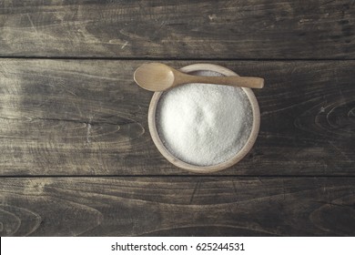 White Sugar With Spoon In Wooden Bowl, From Above
