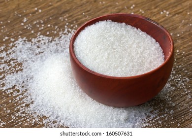 White Sugar In Wood Bowl