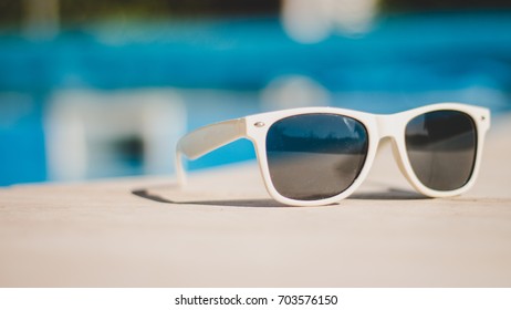 White Sunglasses Poolside