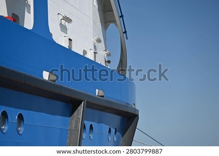 The white superstructure and blue side of the ship
