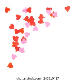 White surface covered with multiple red and pink heart shaped paper confetti as a romantic background composition