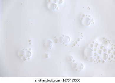 White Surface Of Milk And Bubbles And Ripples From Above Birds Eye View