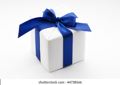 White Surprise Gift Box With Blue Ribbon On White Background