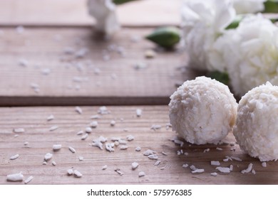 White Sweet Coconut Truffles And Flowers, Close Up