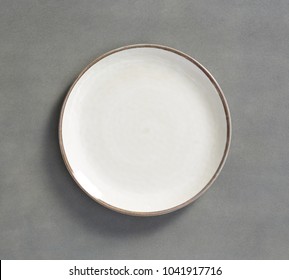 White Swirl Melamine Plate  with dark gray background 