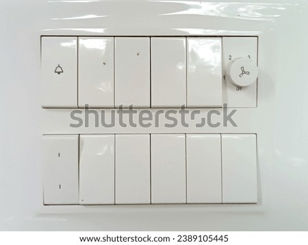 White switch board on wall close-up image. 