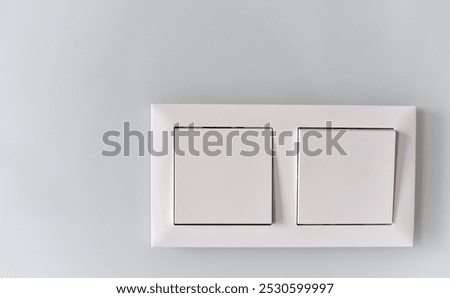White switch on a light wall