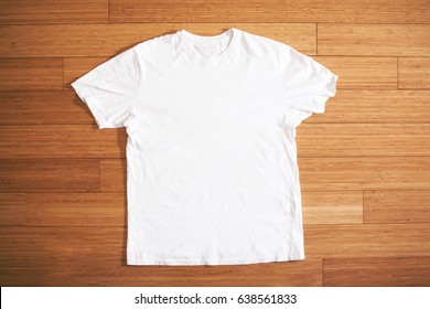 White T Shirt On Wood Floor, Mock Up, Free Space