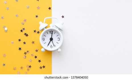 White Table Clock, Alarm On Yellow Background, Top View. Good Morning. Minimalism, Flatlay