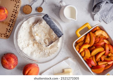 White table with ingredients for peach cobbler pie - Powered by Shutterstock