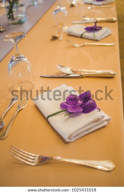 White Table Napkin Decorated Purple Orchid Royalty Free Stock Image