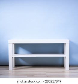 white table on a blue background