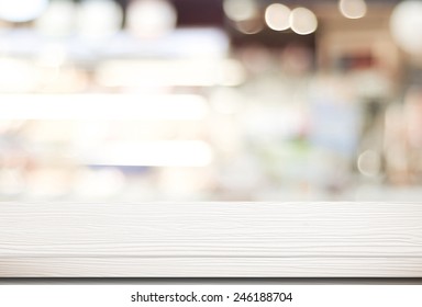 White Table Surface At Cafe Background For Food And Product Display, Wood Shelf For Shop Presentation Background, Empty White Wood Table Top, Counter Over Blur Bokeh Light, Retail Store Banner