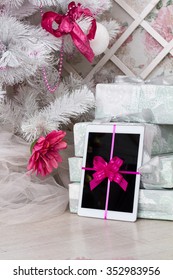 White Tablet As A Gift Under The Christmas Tree