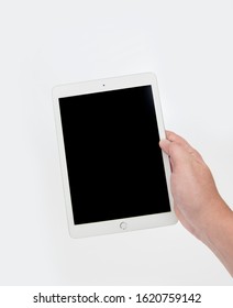 White Tablet in Hand, empty screen - Shutterstock ID 1620759142