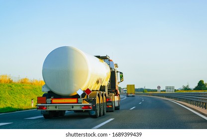 White Tanker storage truck at the asphalt highway, Poland. Business industrial concept.
