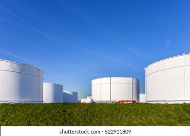 White Tanks In Tank Farm With Blue Clear Sky