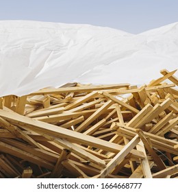 White Tarp Covering Pile Of Wood 2x4 Studs Used For Construction, Near Pullman