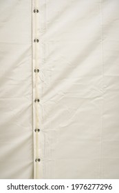 White Tarp Or Waterproof Tarpaulin Fastened With Belt.