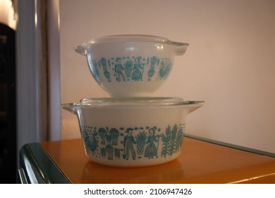 White and teal Pyrex dishes