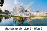 White Temple Chiang Rai Thailand with reflection in the water, Wat Rong Khun or White Temple, Chiang Rai, Northern Thailand.