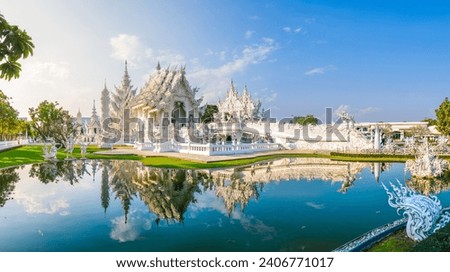 White Temple Chiang Rai Thailand, Wat Rong Khun Northern Thailand with reflection in the pond, panoramic view