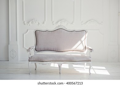 White Textile Classical Style Sofa In Vintage Room. White Background.