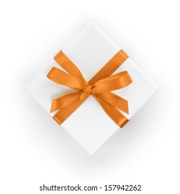 White Textured Gift Box With Orange Ribbon Bow, From Above