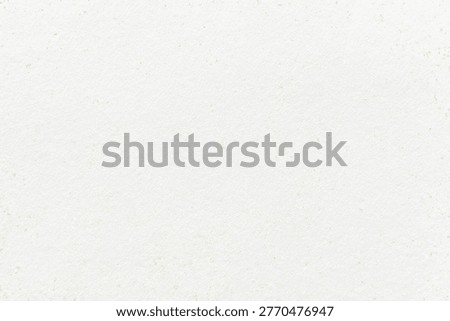 White textured paper background with subtle grainy texture