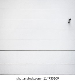 White textured wall with security camera