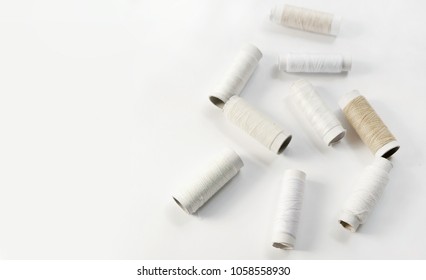 White thread on white background