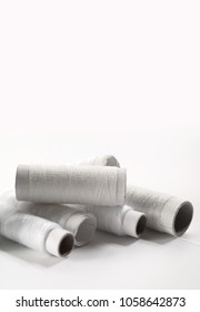 White thread on white background