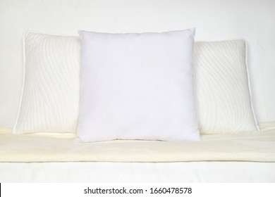 White Throw Pillow Mockup On Plush White Couch