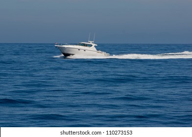 White Tiara Cabin Cruiser Underway