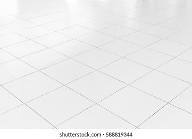 White Tile Floor Background In Perspective View. Clean, Shiny, Symmetry With Grid Line Texture. For Decoration In Bathroom, Kitchen And Laundry Room. And Empty Or Copy Space For Product Display Also.