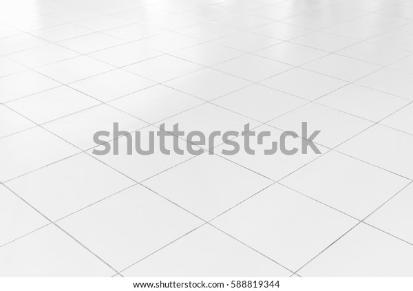 White tile floor background in perspective view.
Clean, shiny, symmetry with grid line texture. For decoration in
bathroom, kitchen and laundry room. And empty or copy space for
product display also.