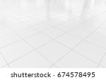 White tile floor clean and symmetry with grid line texture in perspective view for background. Flooring permanent covering by tile, Square shape of white tile made from ceramic material covering floor