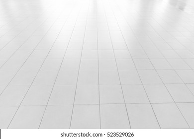 white tile floor in office.White tiles floor for bedroom , kitchen, bathroom and interior design.White tiles floor in perspective view. Clean and symmetrical surface with grid texture background. - Shutterstock ID 523529026