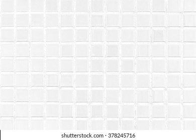 White Tile Modern Wall Background In Toilet. Gay Glass Mosaic Texture With Light In Top. Table Pattern For Scene And Backdrop.