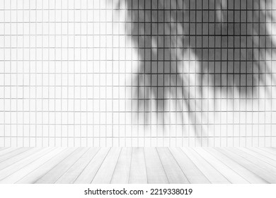 White Tile Wall With Coconut Leaves Shadow And Wooden Floor, Suitable For Product Presentation Backdrop, Display, And Mock Up.