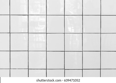 White Tiles Floor. Closed Up Of White Glossy Ceramic Brick Tiles Floor Texture, Tile Pattern In A Bathroom