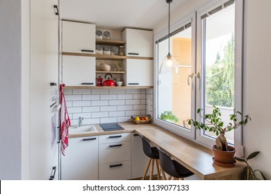 White Tiny Modern Kitchen With Red Components, Reconstruction, Cosy Small Panel House In Prague, Czech Republic