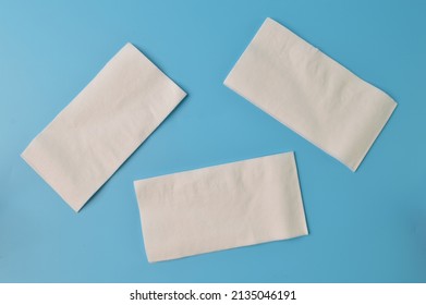 White tissue papers isolated on a blue background