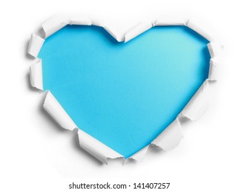 White Torn Paper With Heart Shape Over Blue Background