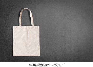 White Tote Bag Canvas Fabric Cloth Eco Shopping Sack Mockup Isolated On Blackboard Background With Copyspace