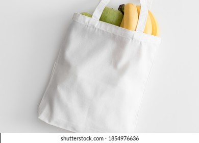 White Tote Bag Mockup With Fruit On A White Table.